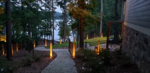 Outdoor lighting providing support to a backyard walkway.